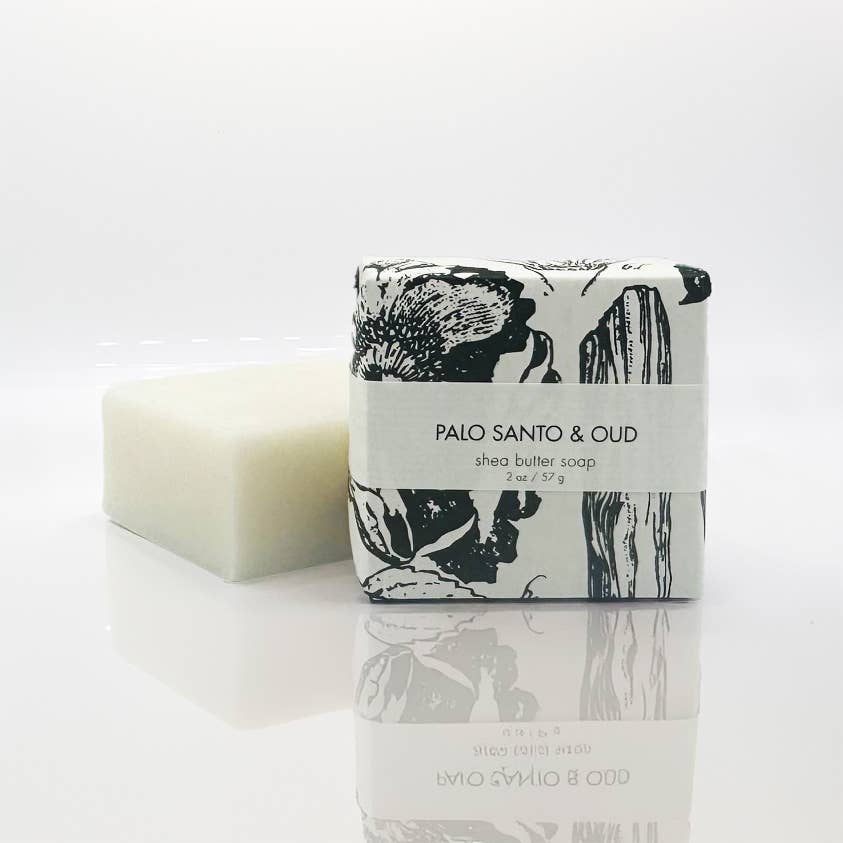 Shea butter soap bar with a black and white label on a white background