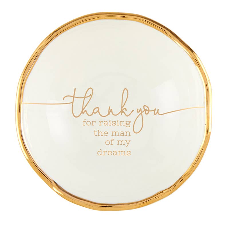 Round white plate with gold rim and text on a white background