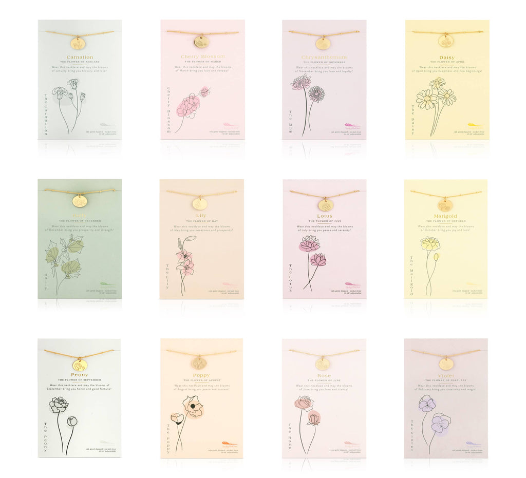 Set of necklaces with floral pendants on branded cards.