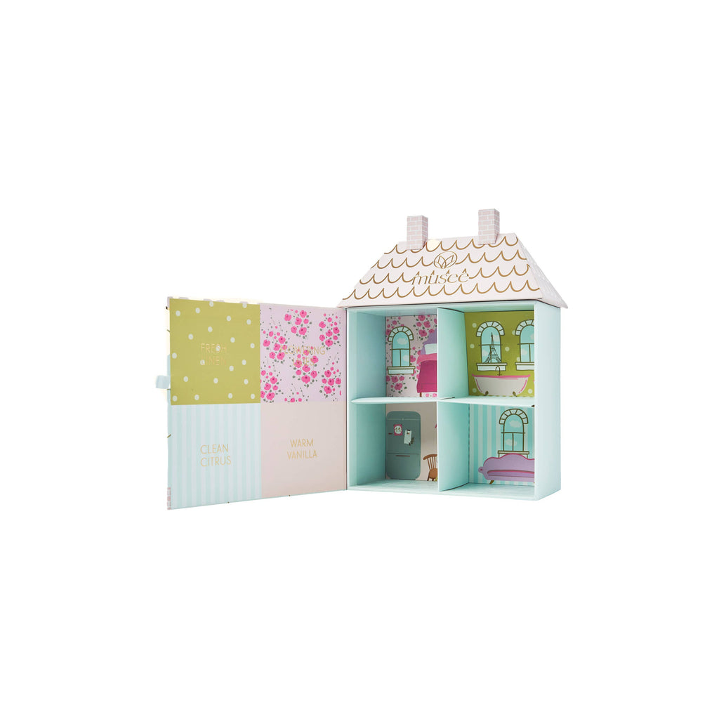 Children's toy dollhouse with colorful exterior and open doors on a white background