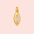 Gold pendant with a clear gemstone on a pink background