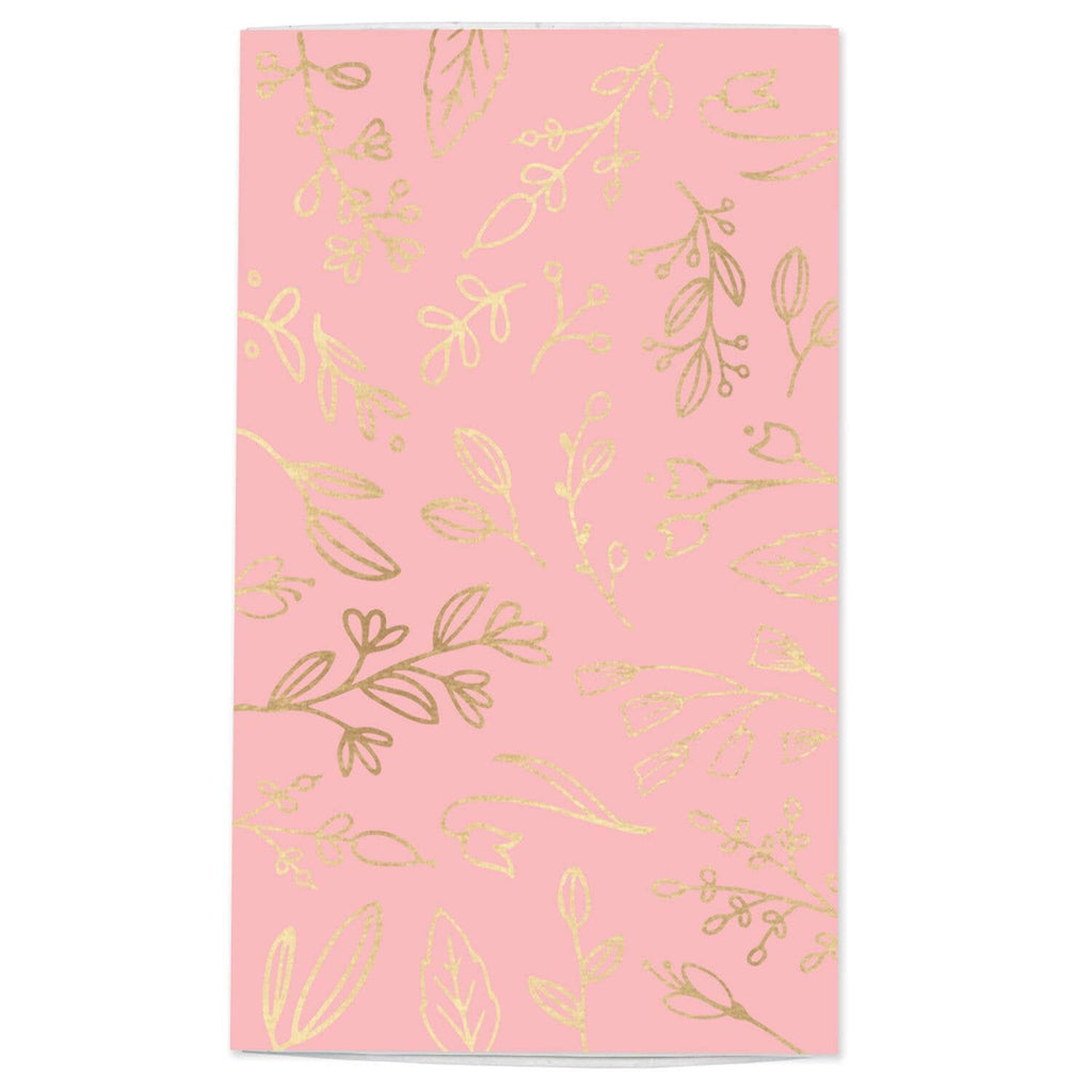 Pink paper with gold floral patterns on a white background