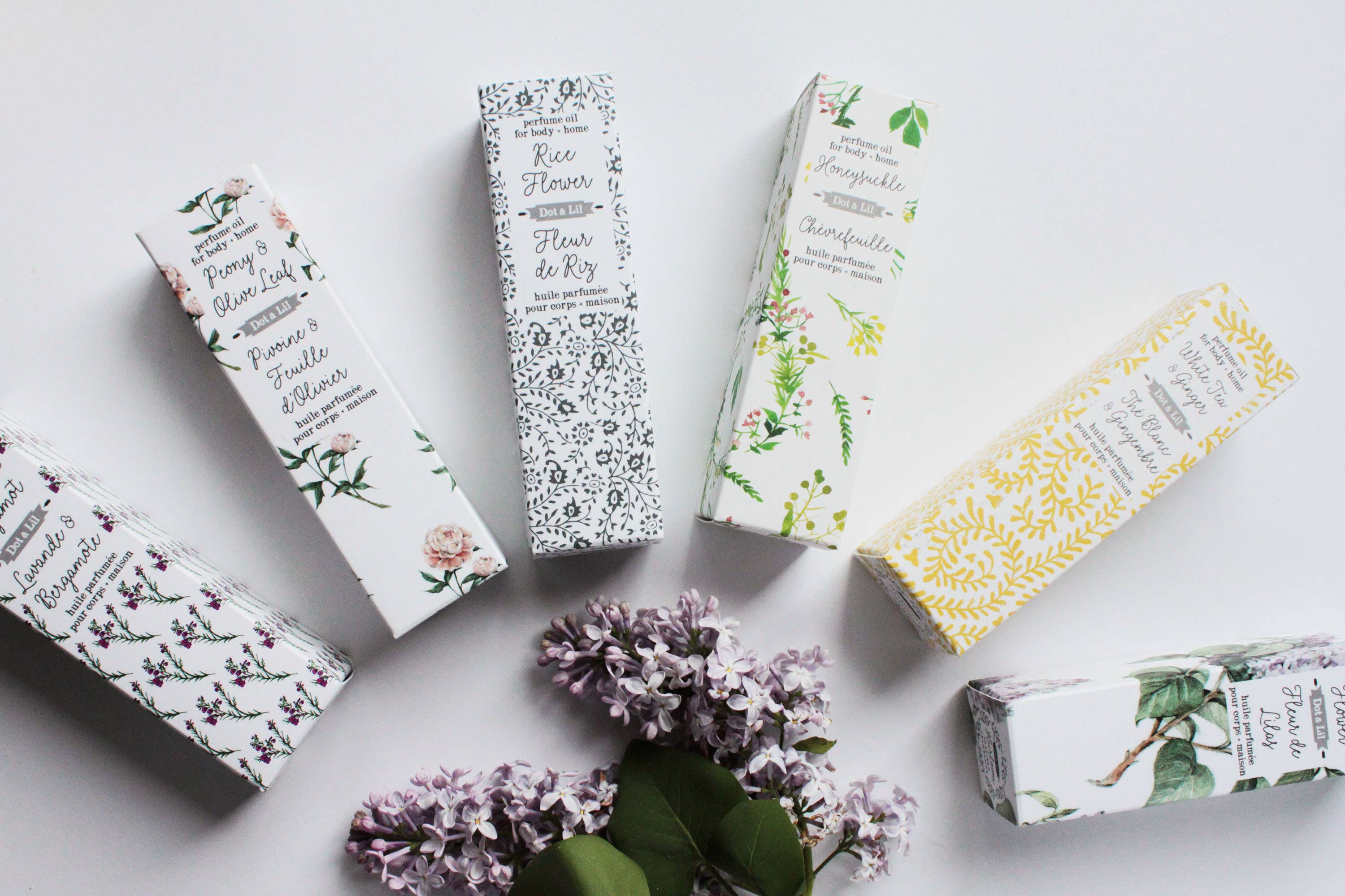 Various boxes with floral designs and text on a light background