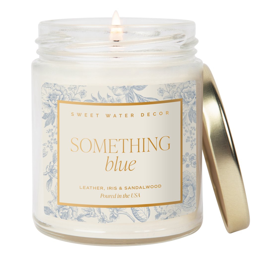 Candle in a jar with a decorative label on a white background