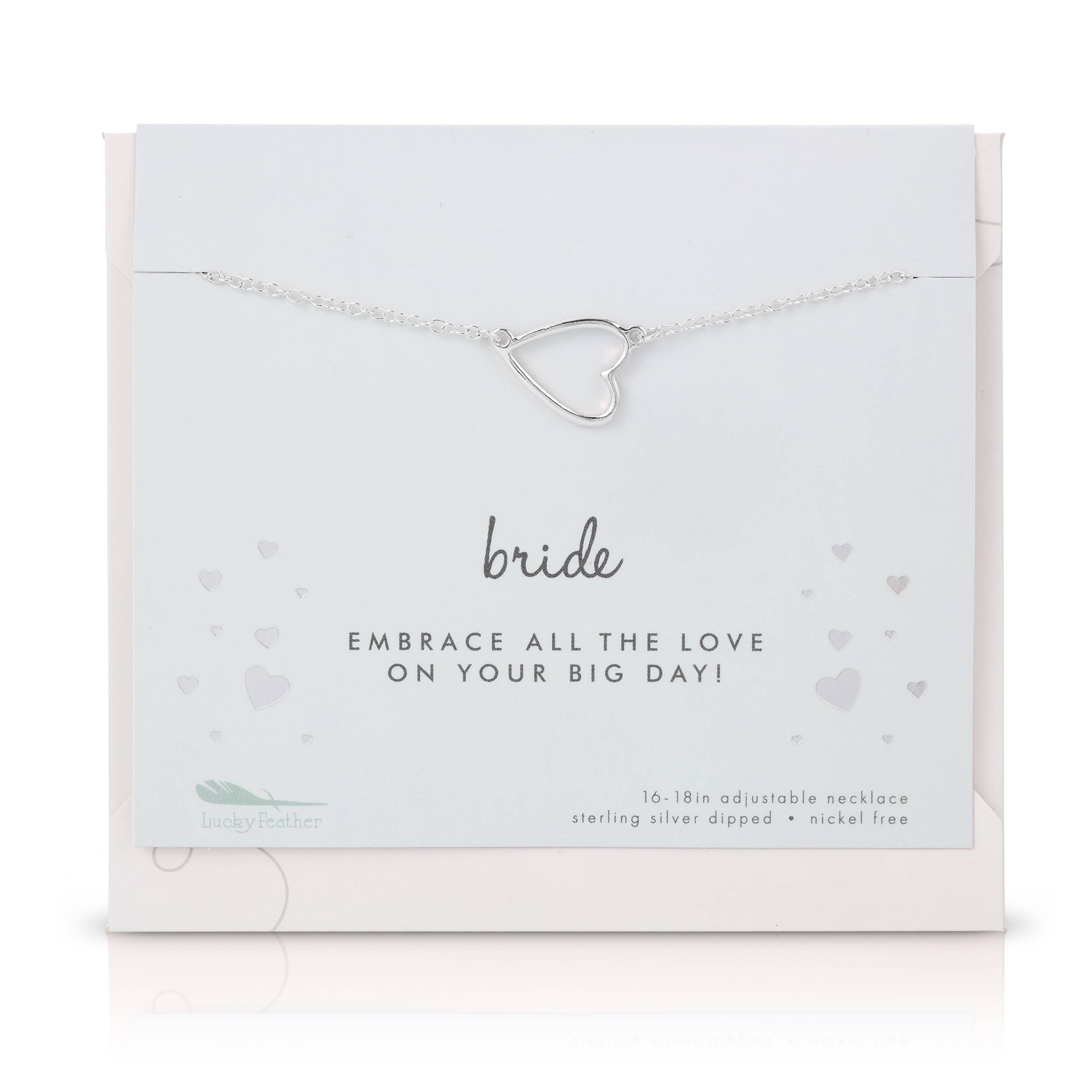 Silver heart-shaped necklace on a branded card with 'bride' text.