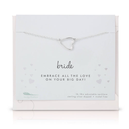 Silver heart-shaped necklace on a branded card with 'bride' text.