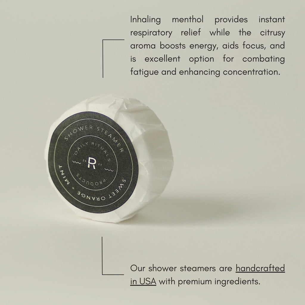 White shower steamer with black label on a light gray background