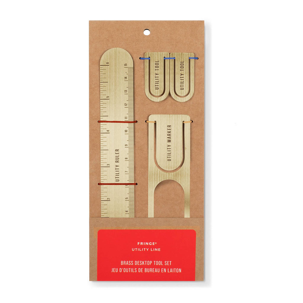 Brass desk top tool set packaging on a white background