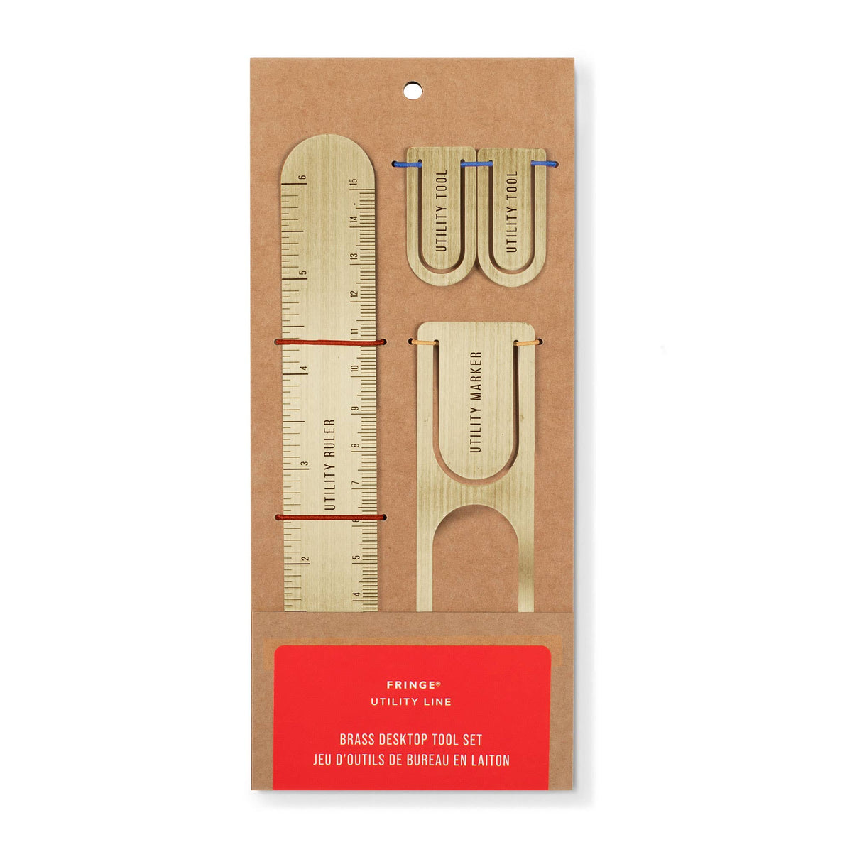 Brass desk top tool set packaging on a white background
