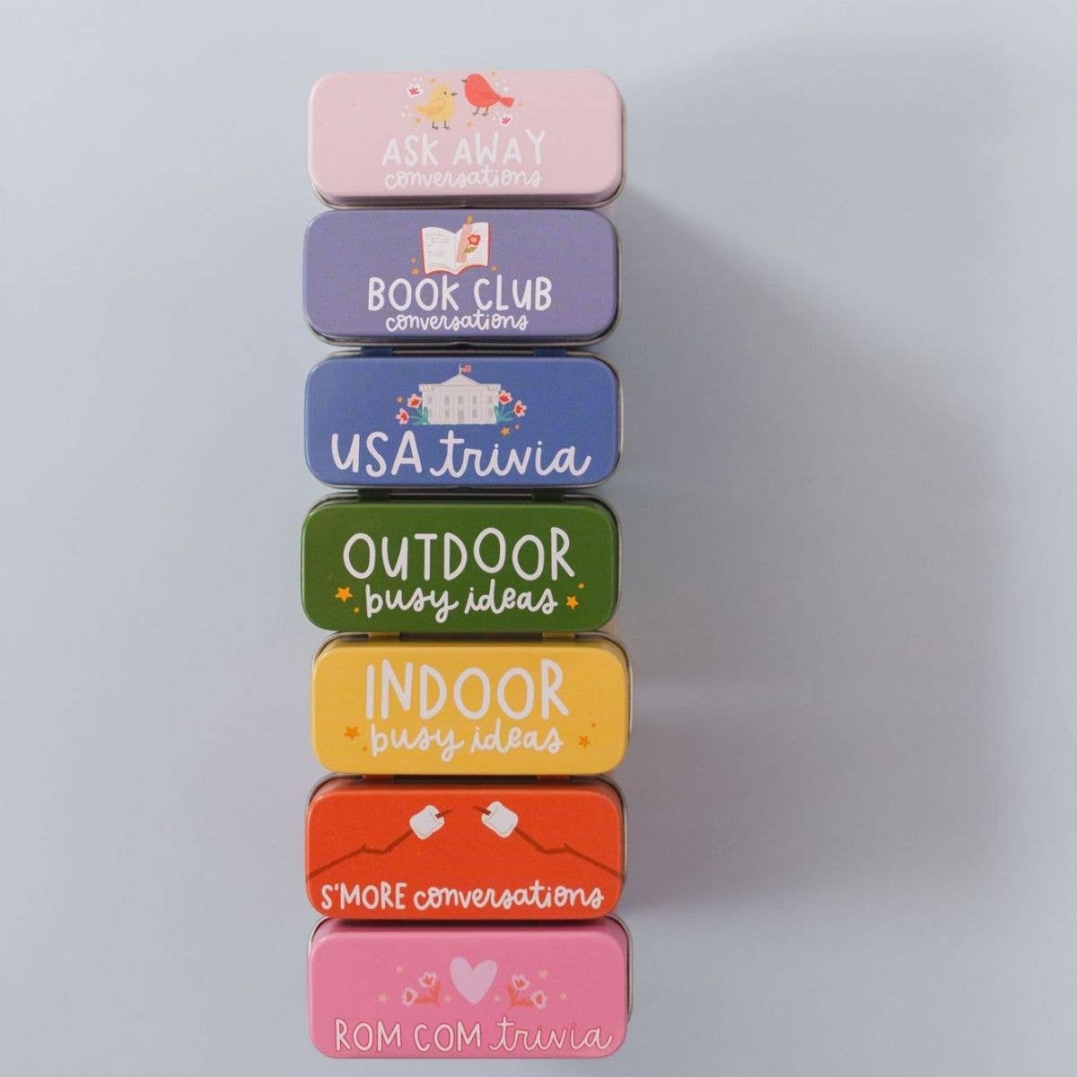 Stack of colorful rectangular containers with text on a gray background
