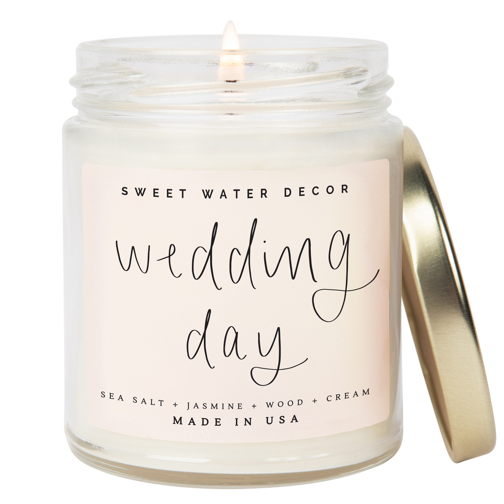 Candle in a jar with 'Sweet Water Decor' branding and 'wedding day' label on a white background