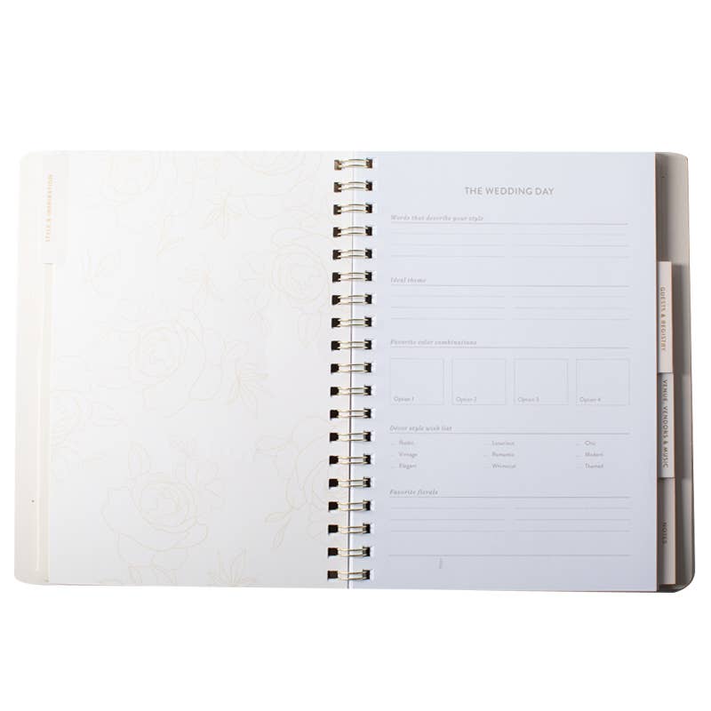 Inside pages of the Cascading Roses wedding planner showing organized wedding planning sections and premium layout.