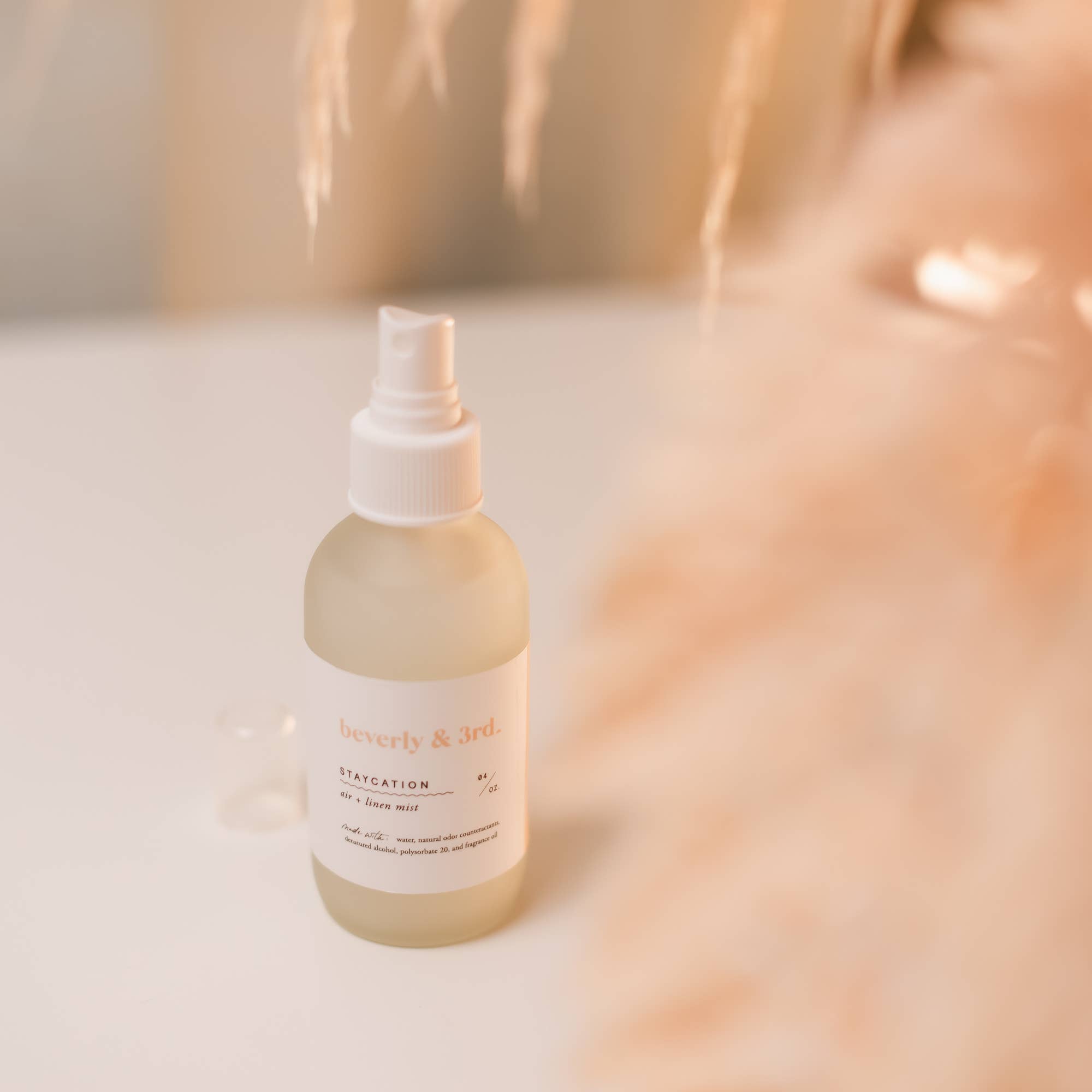 Beverly & Aid hair product bottle on a blurred background