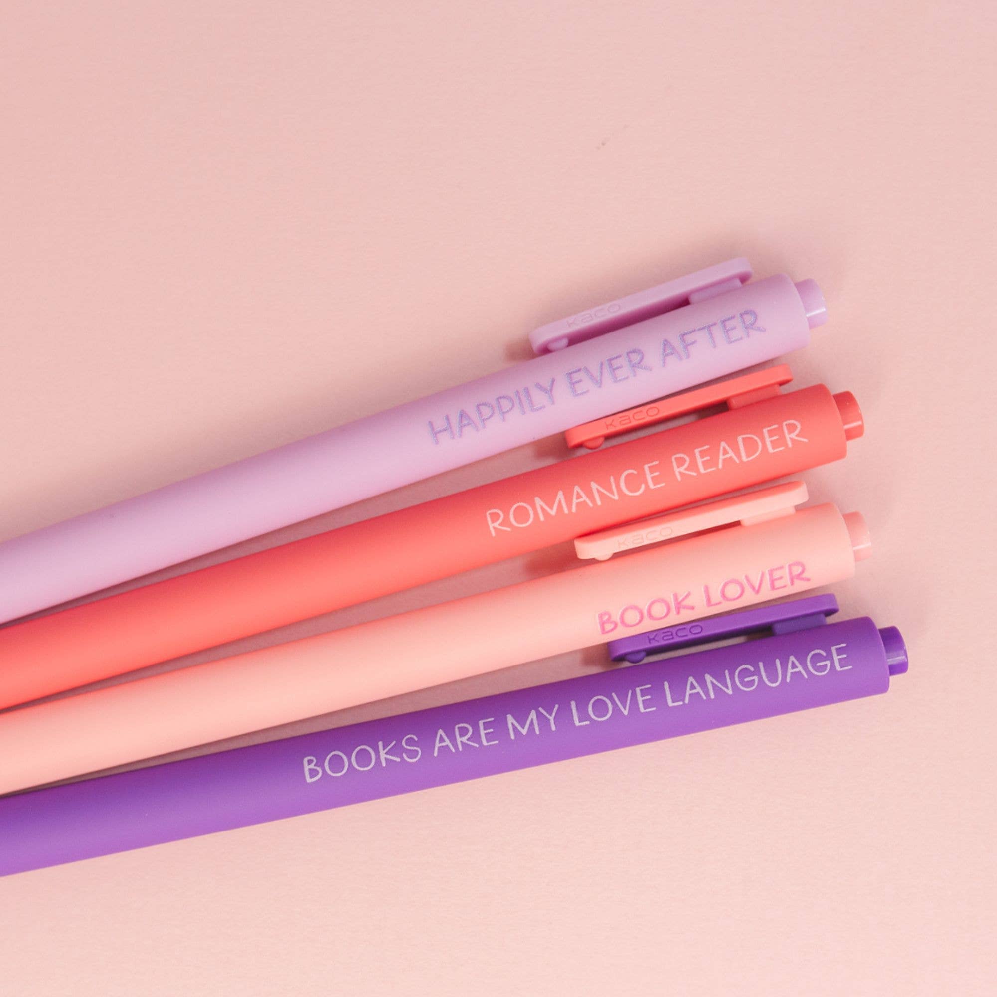 Complete four-piece Book Lover pen collection in pastel pink and purple.