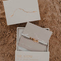 Bracelet in a 'The Stone' box on a textured surface