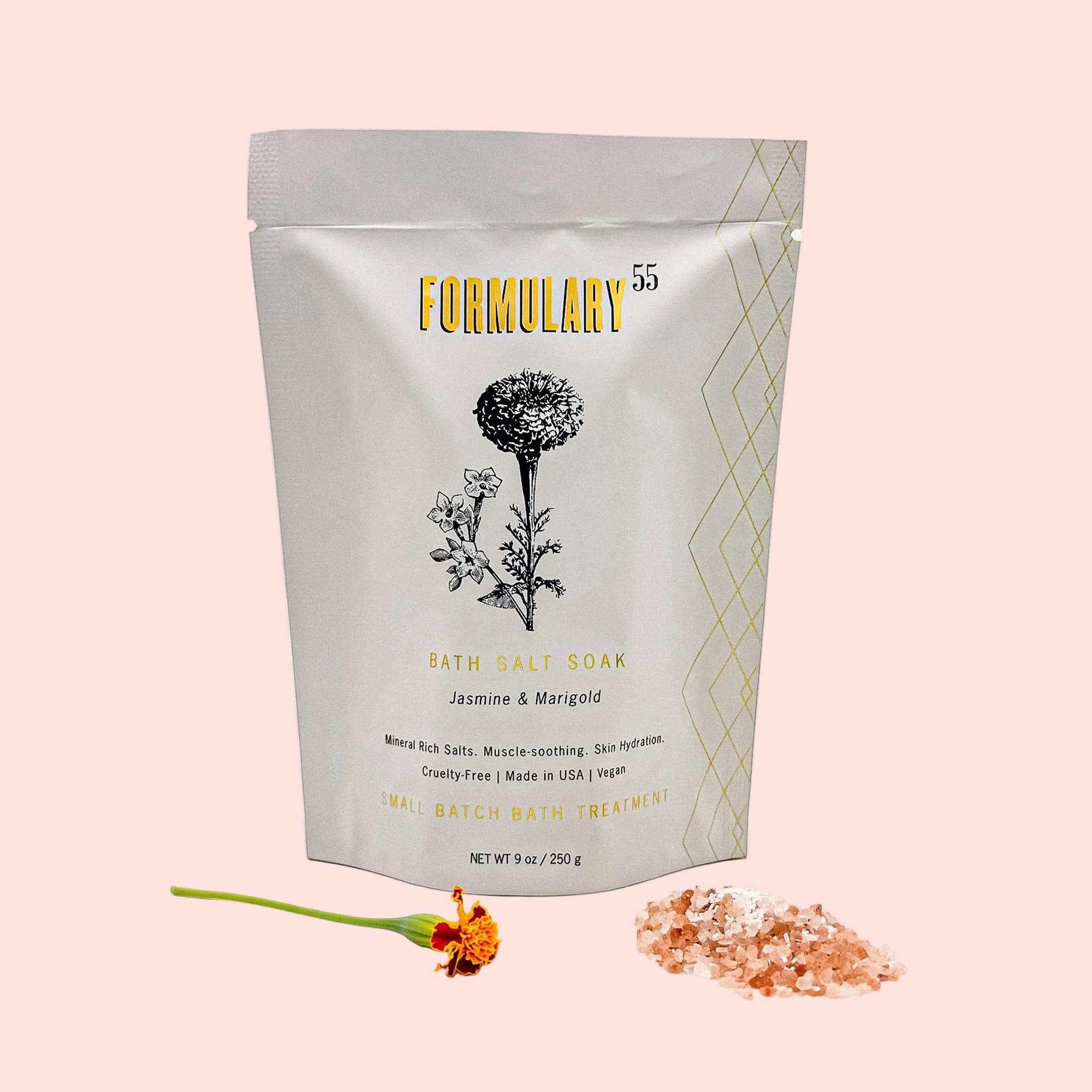 Packaging of Formulary 55 bath salt soak with floral design on a white background