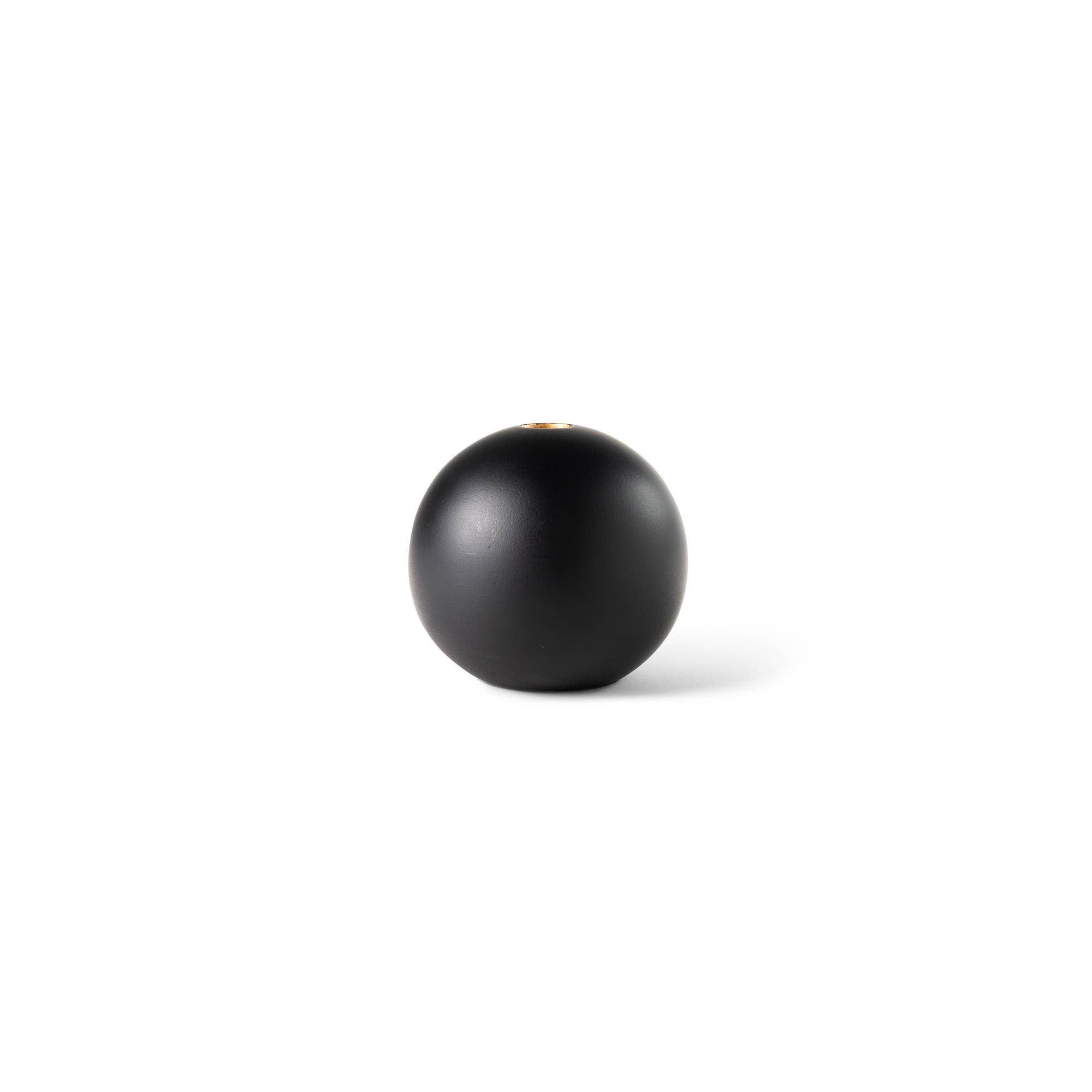 A matte black spherical object, possibly a decorative vase or container, centered on a plain white background with a soft shadow.