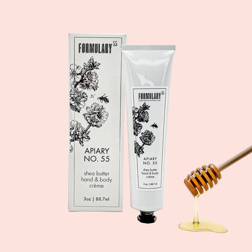 Formulary 55 Apiary No. 55 shea butter hand & body crème with packaging and honeycomb on a white background