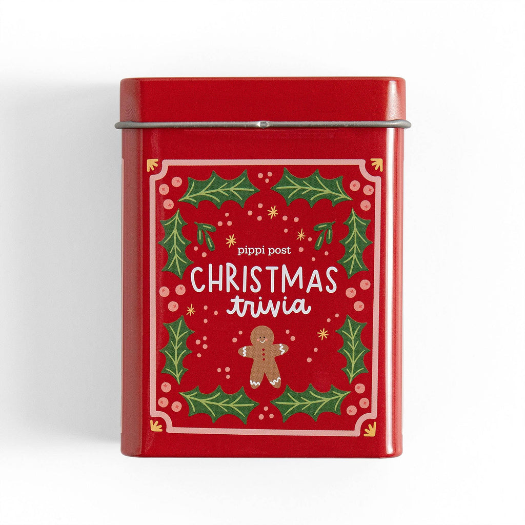 Red tin box with Christmas-themed design and text on a white background