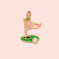 Gold pendant shaped like a golf flag with a pink top and green base on a light pink background