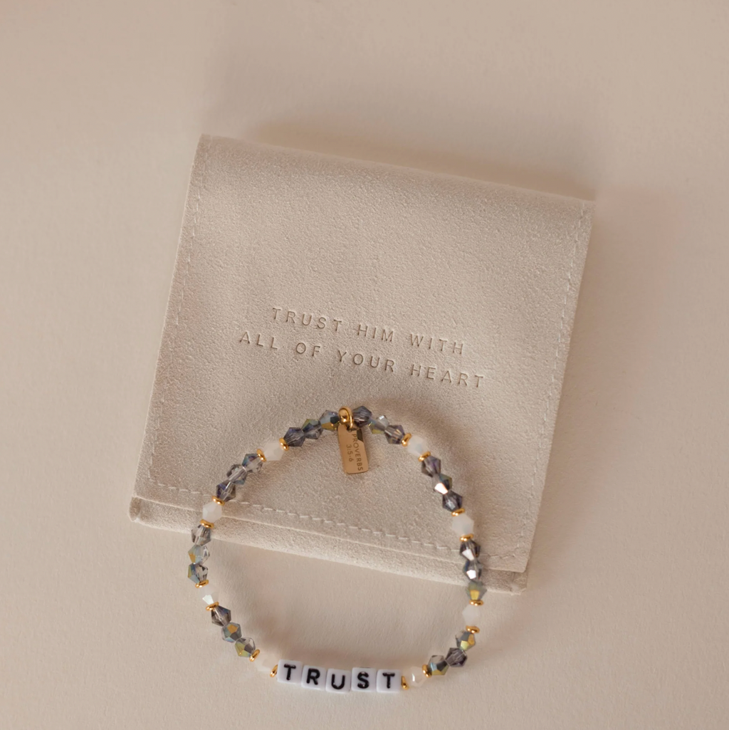 Bracelet with motivational message on a beige background