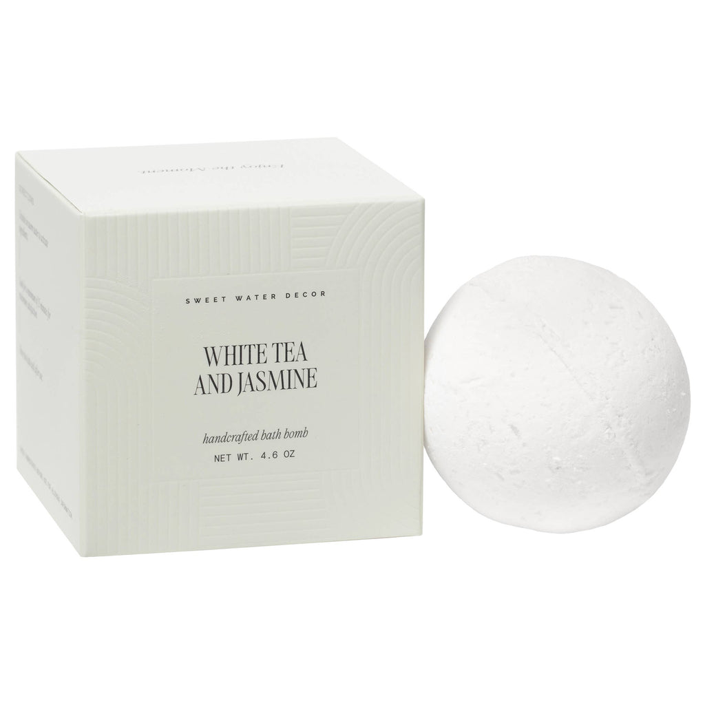 White tea and jasmine bath bomb with packaging on a white background