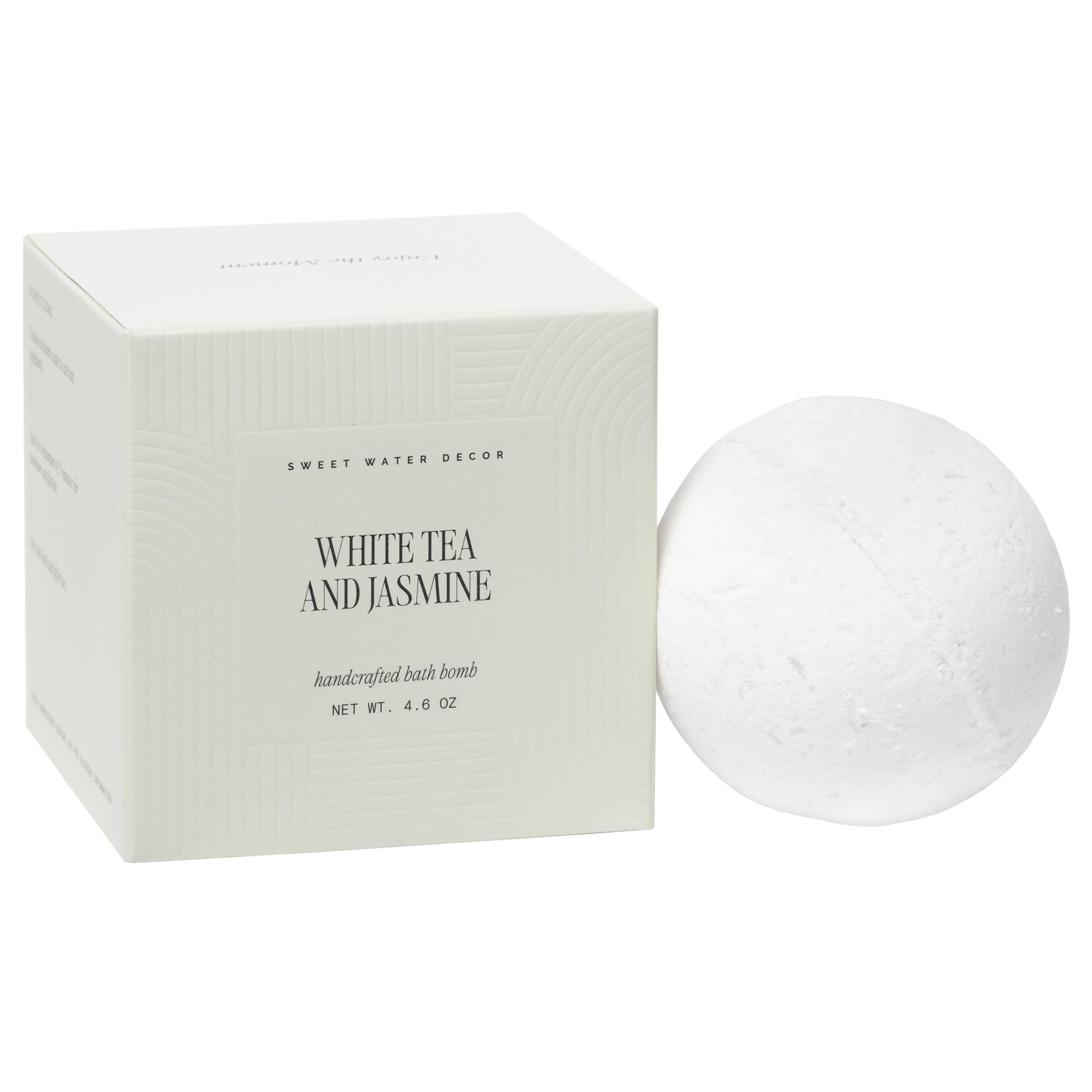 White tea and jasmine bath bomb with packaging on a white background