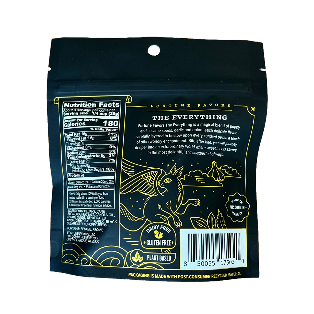 Back view of a black resealable stand-up pouch for Fortune Favors 'The Everything' gluten free plant based flour, featuring gold illustrations of a bird and stars, a nutrition facts panel, and a barcode on a white background.