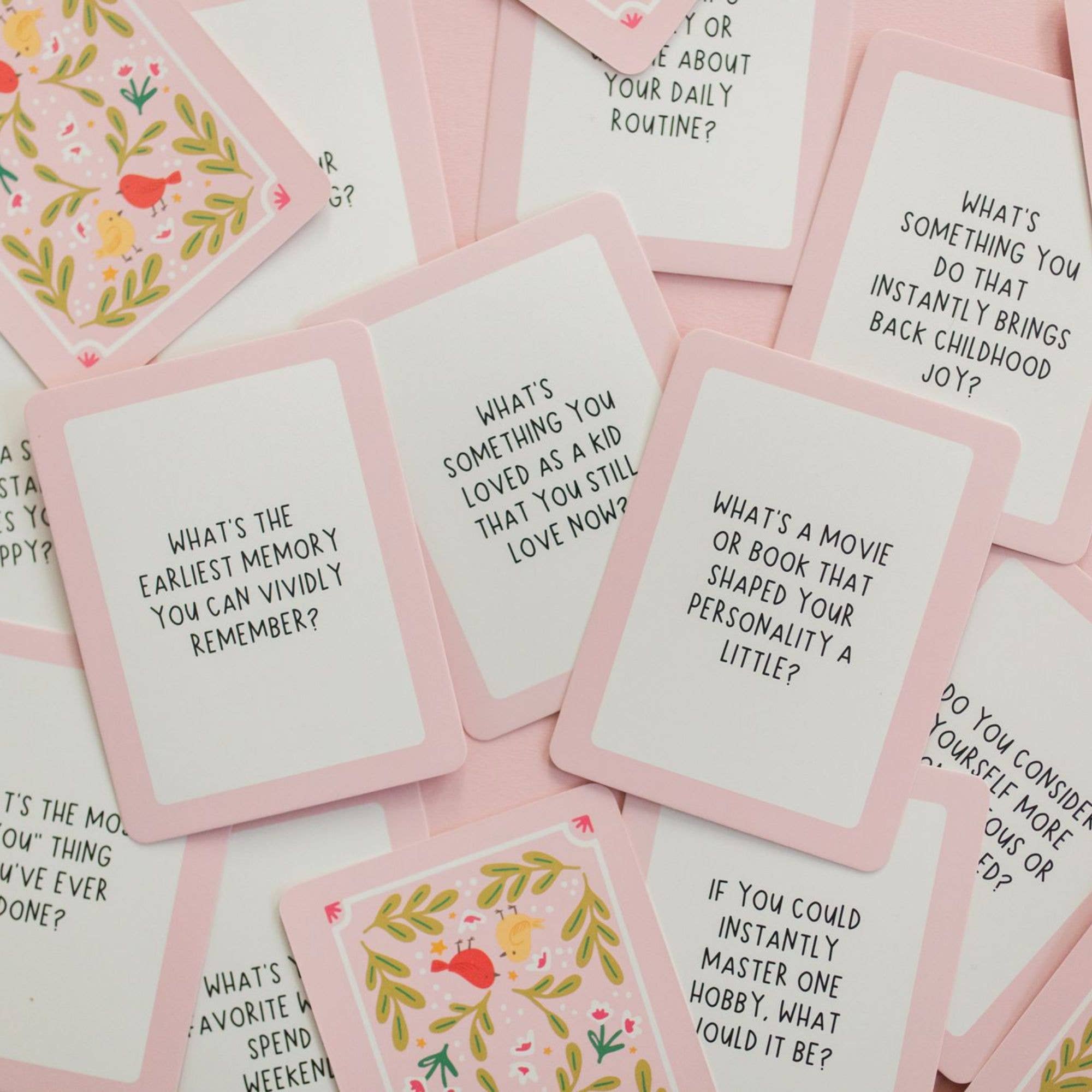 Set of question cards with pink borders and white backgrounds, featuring various questions.