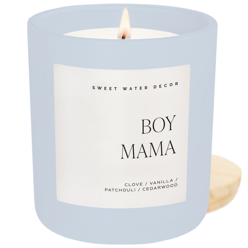 Candle with a label reading 'Boy Mama' by Sweet Water Decor on a white background