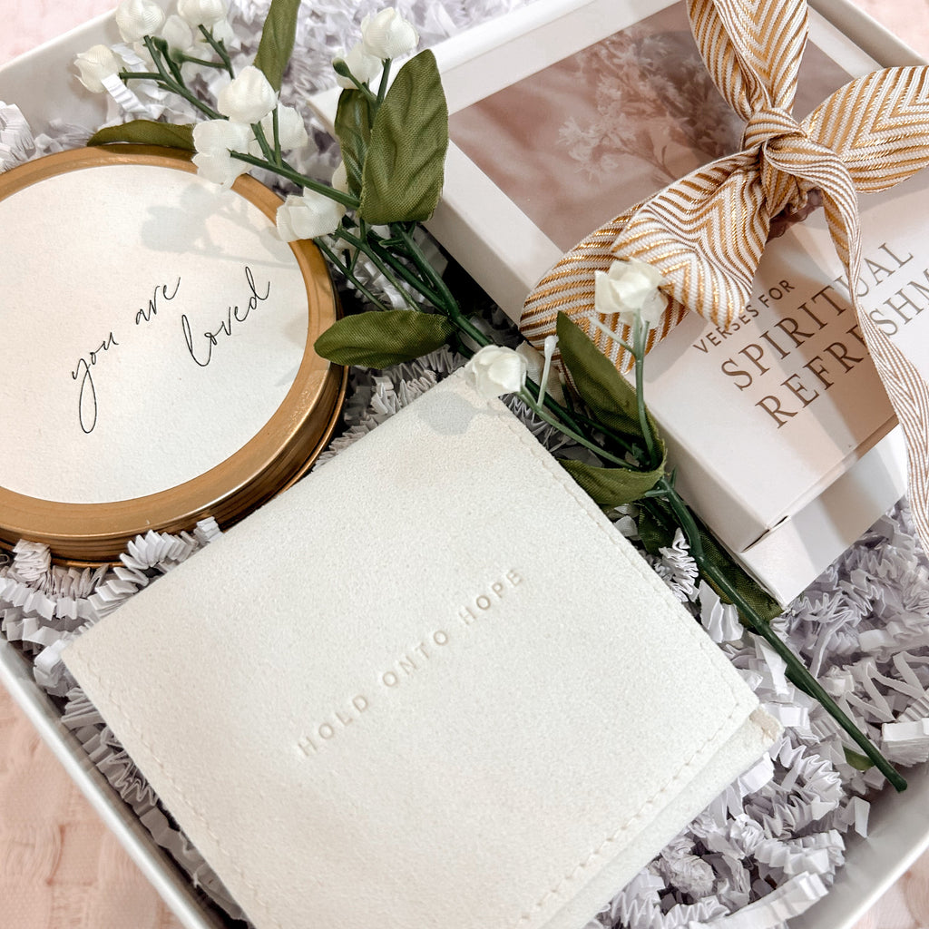 Gift set with towel, soap, and flowers in a box