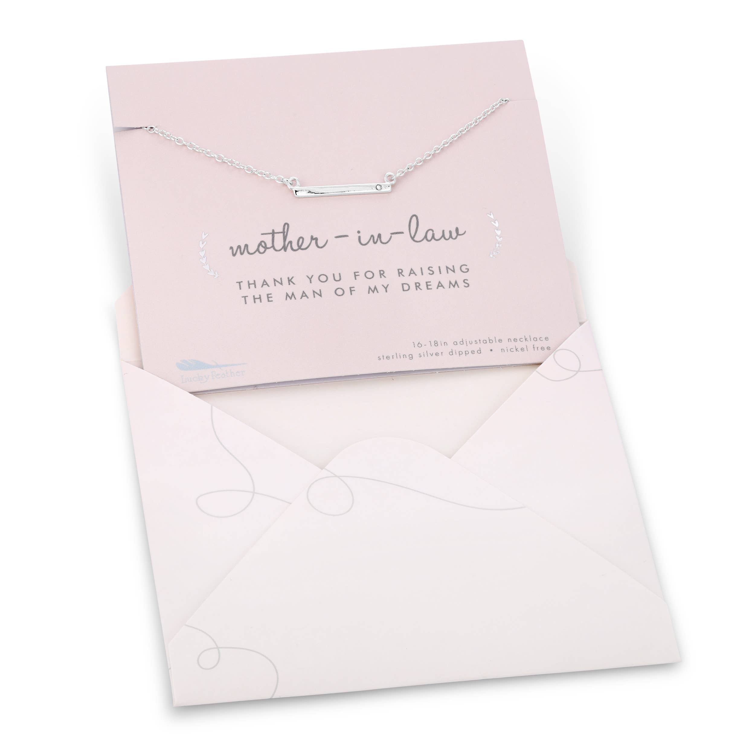 Necklace with 'mother-in-law' card and envelope on a white background