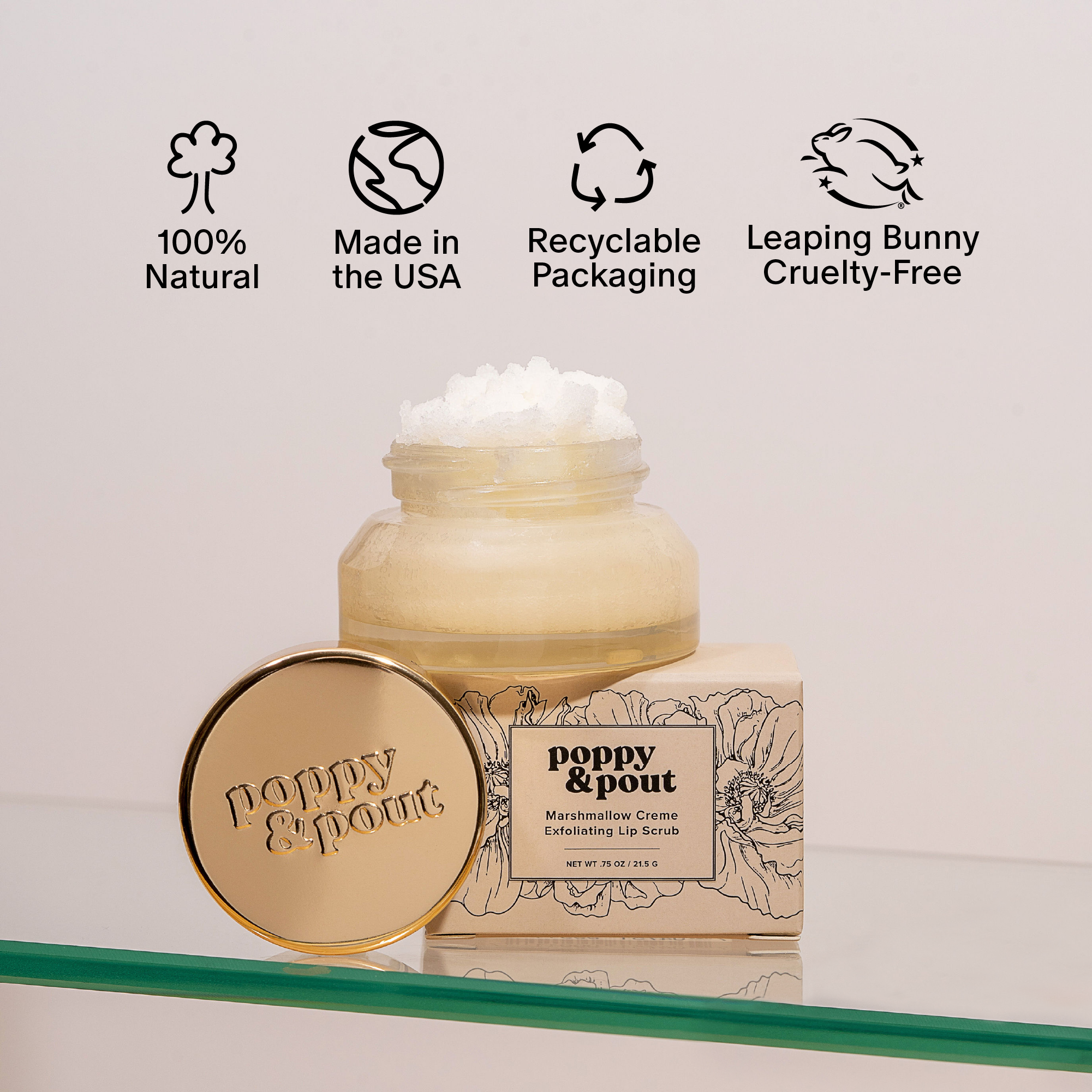 Poppy & Pout lip scrub with branding and certification icons on a light background