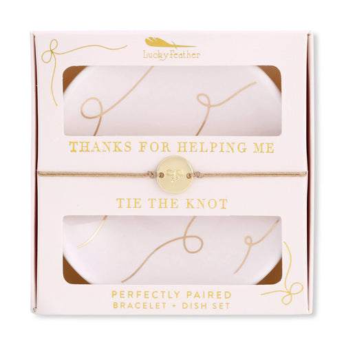 Packaged bracelet and dish set with 'Lucky Feather' branding and text.