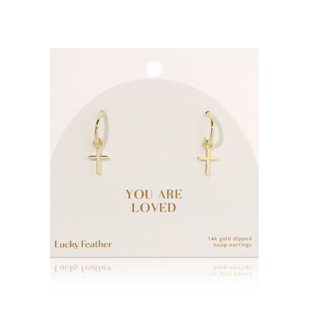 Gold hoop earrings with cross charms on a 'You Are Loved' card by Lucky Feather.