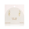 Gold hoop earrings with cross charms on a 'You Are Loved' card by Lucky Feather.