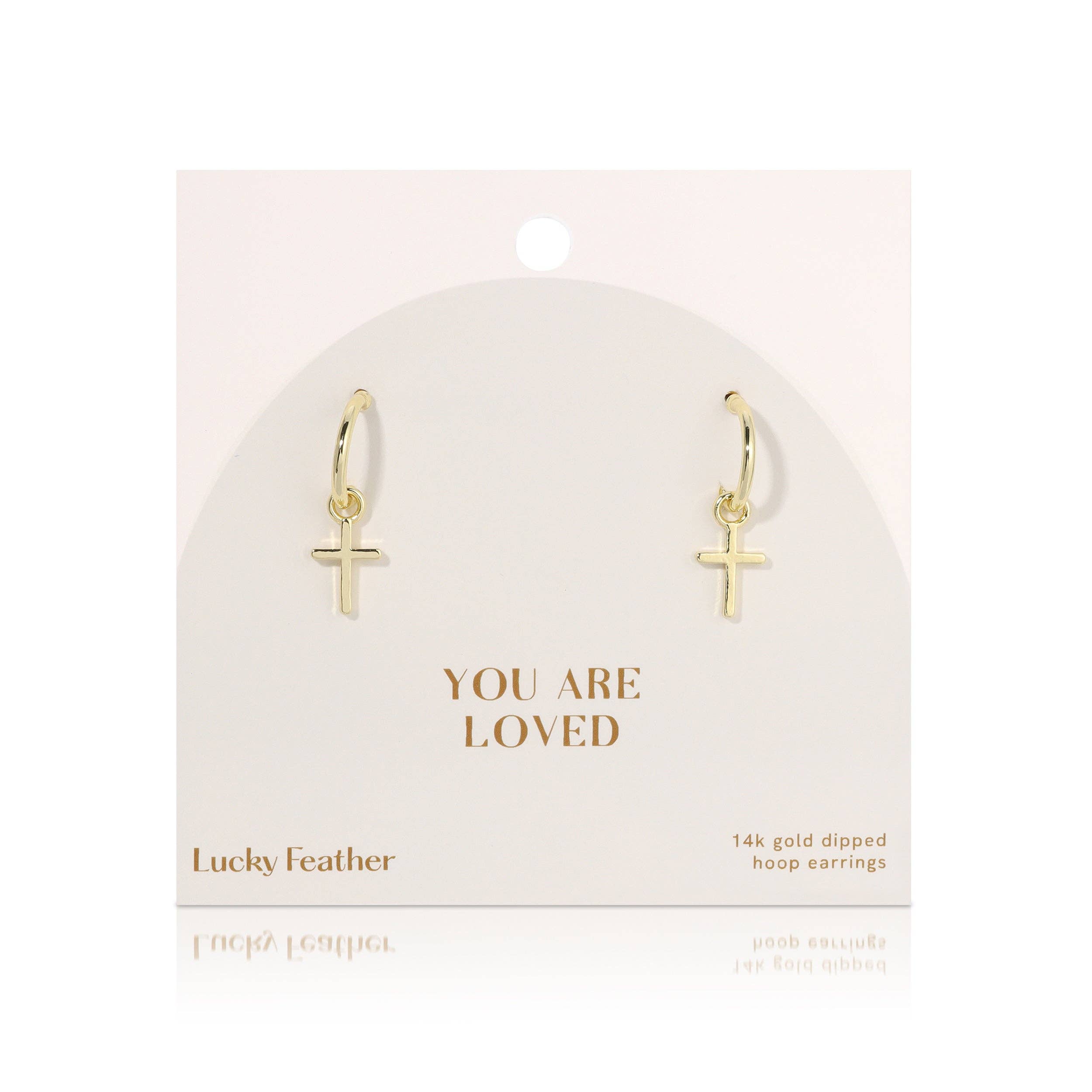 Gold hoop earrings with cross charms on a 'You Are Loved' card by Lucky Feather.