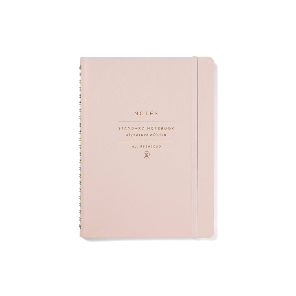 Blush faux leather Signature Edition spiral notebook with gold foil lettering, elastic band closure, and gold spiral binding. A beautiful lined journal for planning, journaling, work notes, and everyday inspiration.