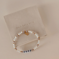 Bracelet with 'HOPE' beads on a beige card with 'Hold onto Hope' text