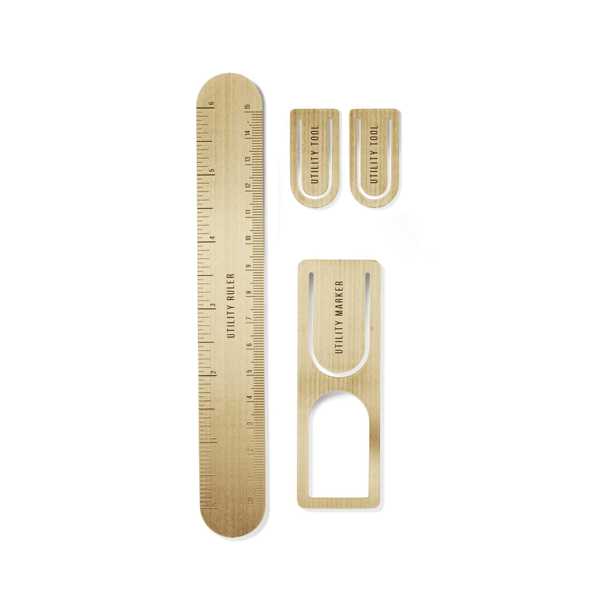 A set of four light wood utility tools on a white background, including a ruler, two small utility tools, and a larger U-shaped marker.