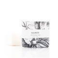 Shea butter soap bar with black and white design and 'Fleuriste' branding on a white background