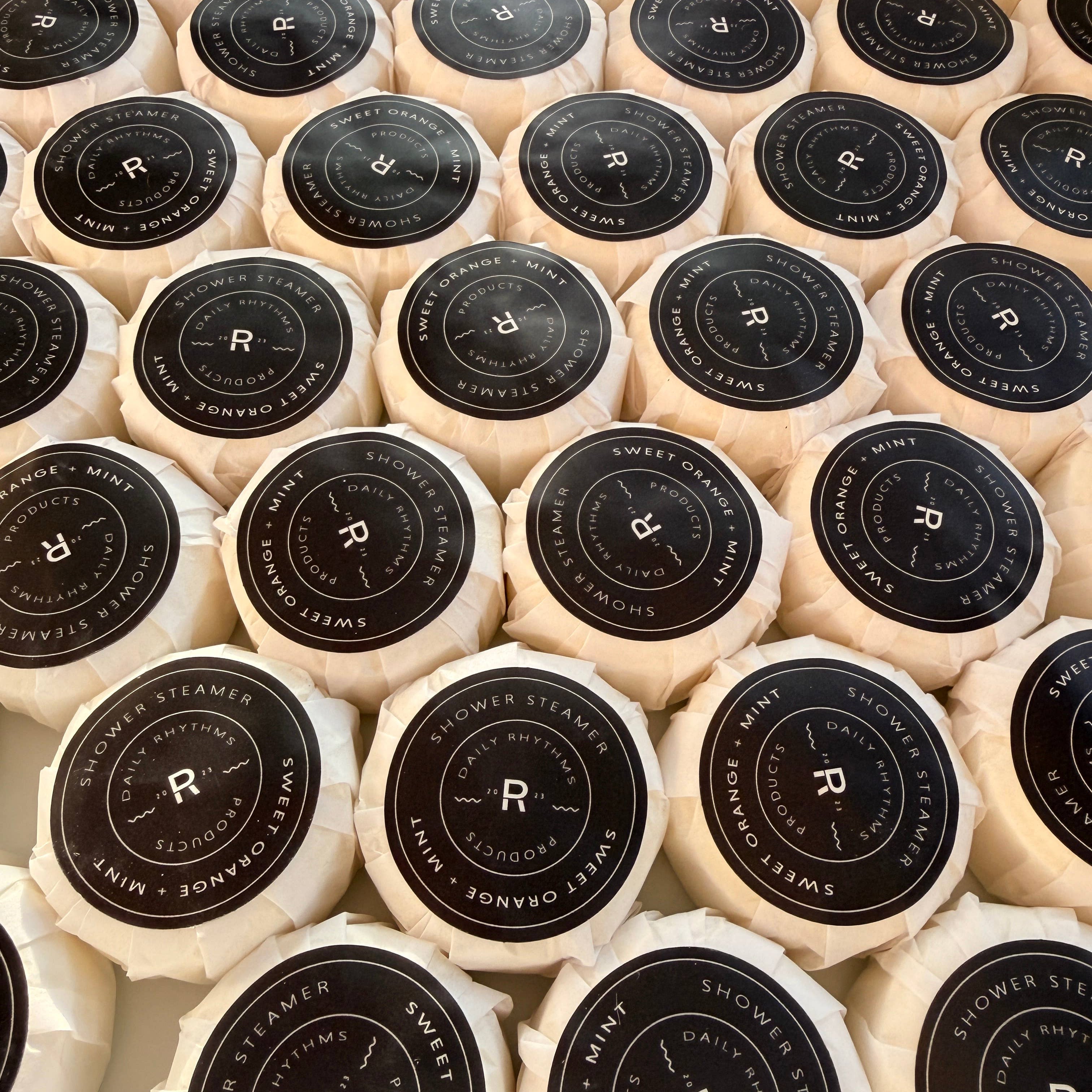Close-up of wrapped products with a brand logo on a grid pattern