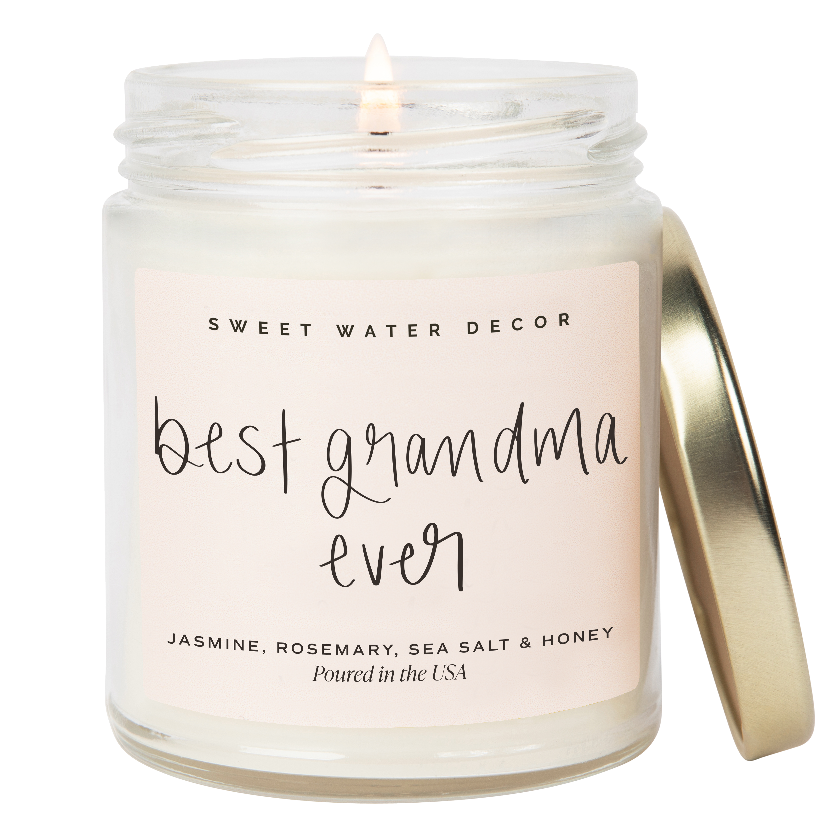 Candle in a jar with 'best grandma ever' text on the label, brand 'Sweet Water Decor' visible.