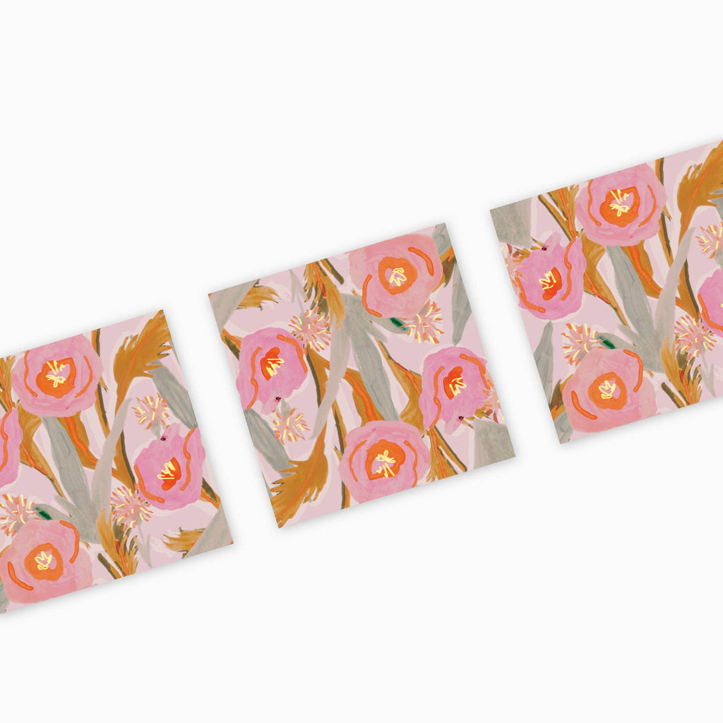 Three floral-patterned notebooks with pink and orange flowers on a white background