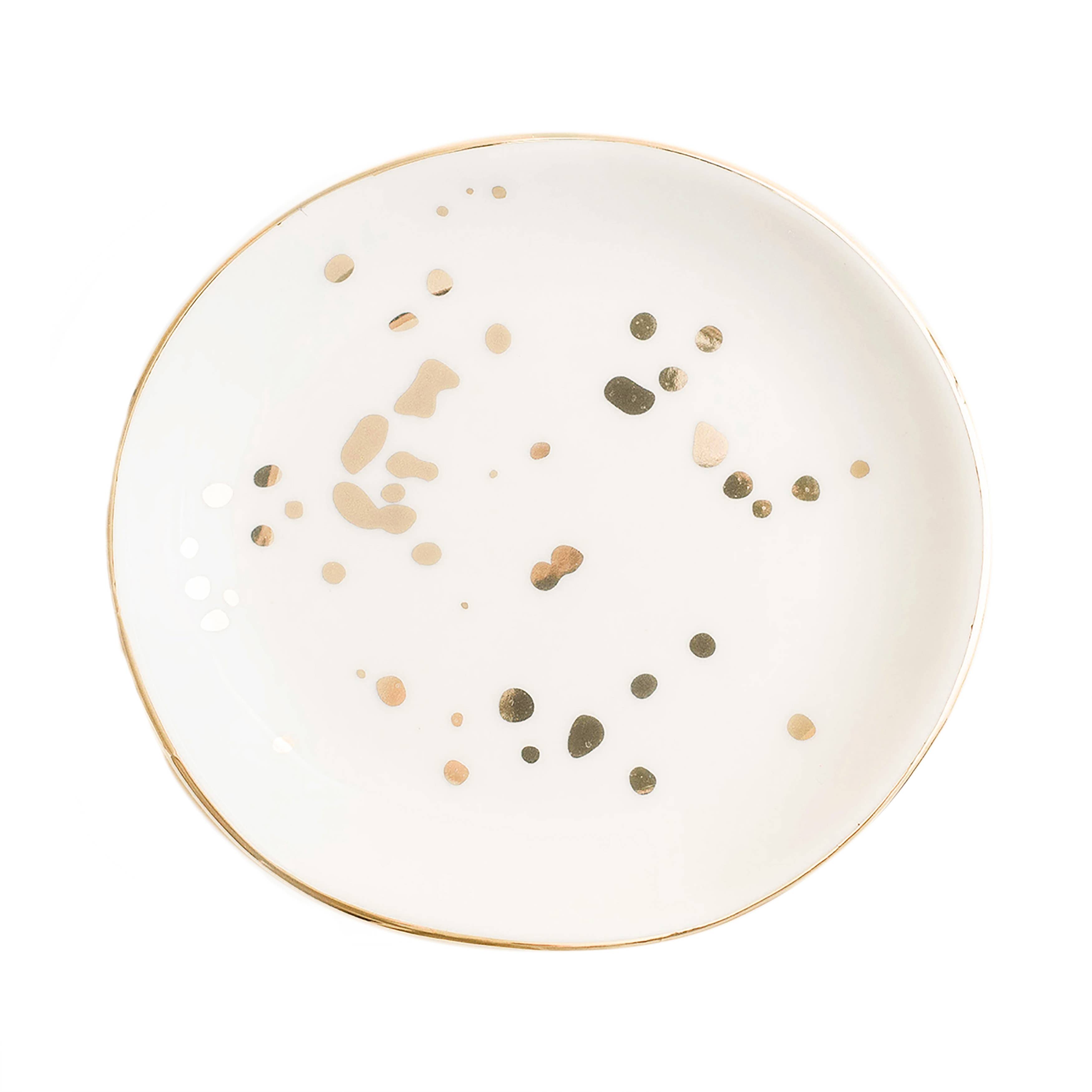 White ceramic plate with gold and green speckles on a white background