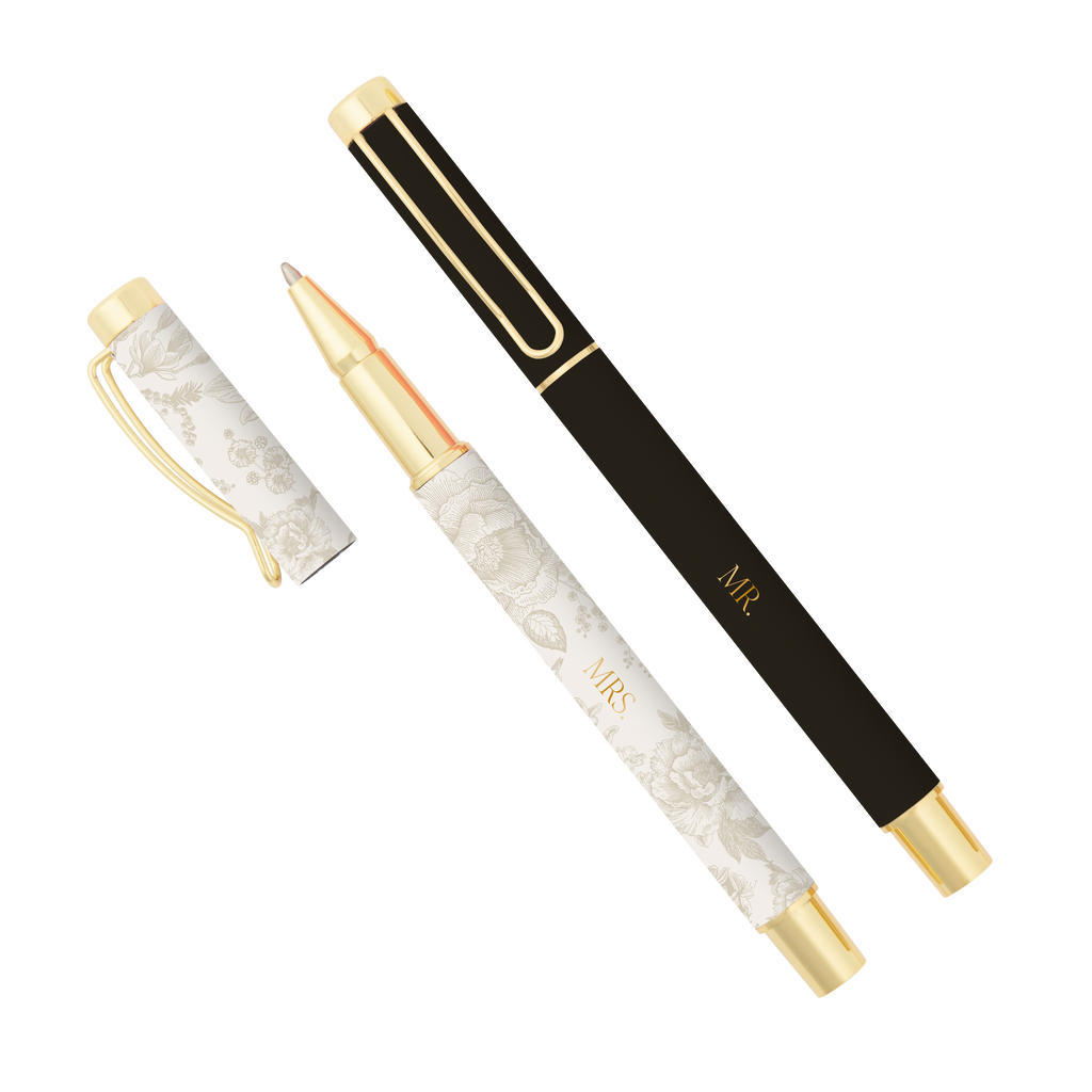 Two pens, one black and gold, one white and gold, on a white background.