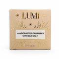 LUMI Handcrafted Caramels with Sea Salt in a square beige box with gold foil botanical and star details, on a white background.