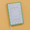Reading Tracker Mini Journal with green floral vegan leather cover.