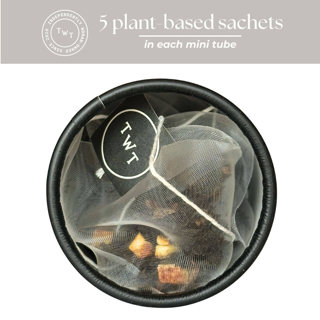 Tea bag with plant-based sachets in a black container, featuring the brand 'TWT'.