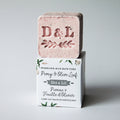 Pink bath cube with 'D&L' branding on a white background